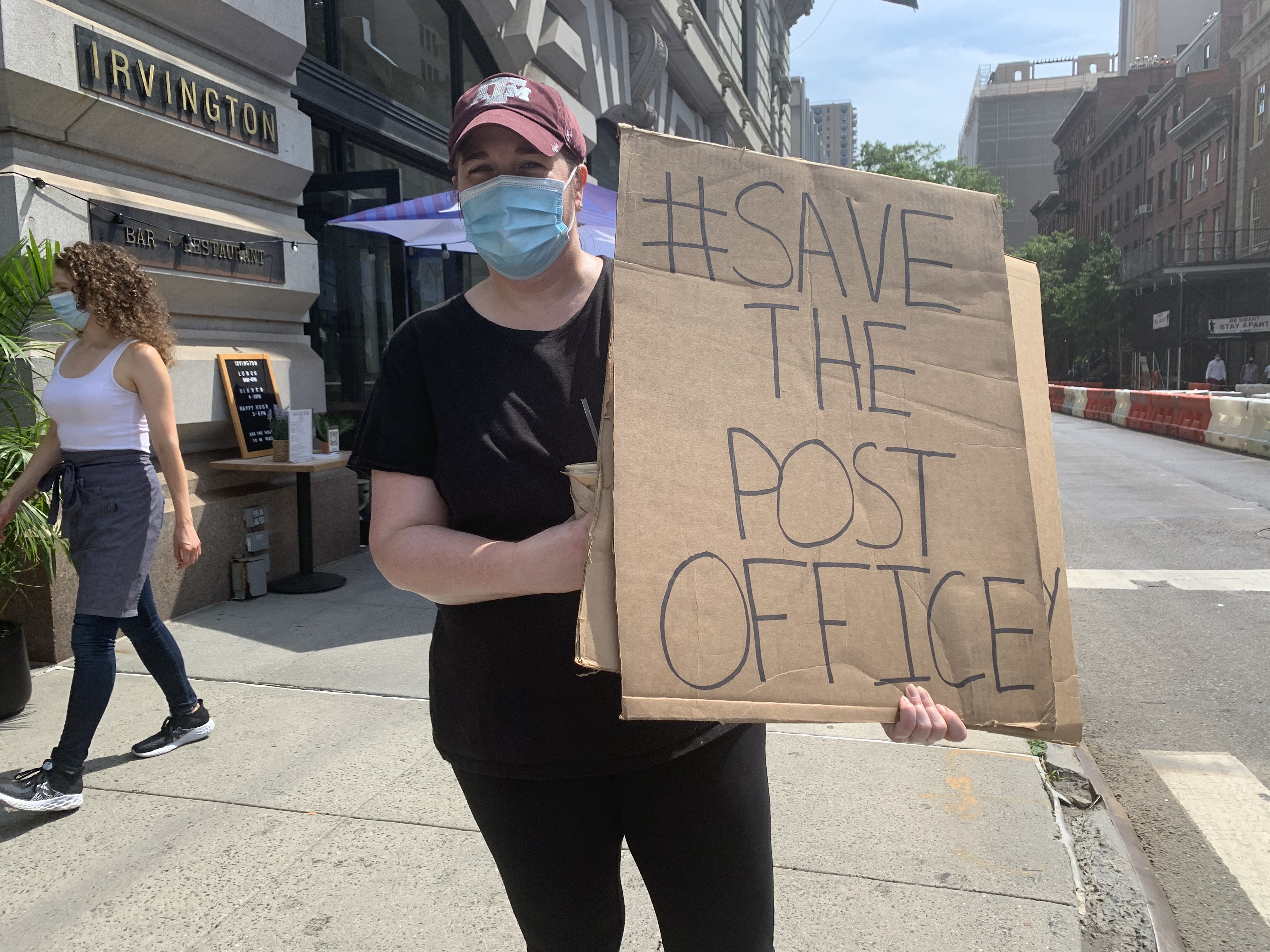 Save the Post Office Protestor. Photo by ConsumerMojo.com